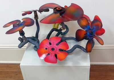 Fred Cole -“Floral Arrangement” recycled gas lines and motor fans