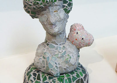 Judith Hugentobler  – “Sentimental Lady with a Small Bear” stoneware, tile, glass and grout