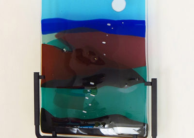 Ellen Rebarber “Moon over Maine”  Fused glass in blues and greens