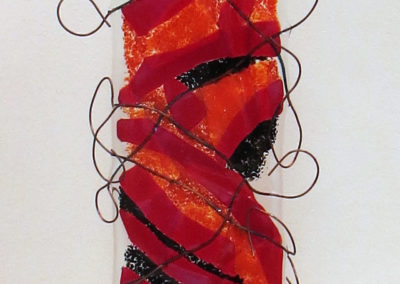 “Don’t fence me in”   fused glass and copper wire and wood,  by Ellen Rebarber
