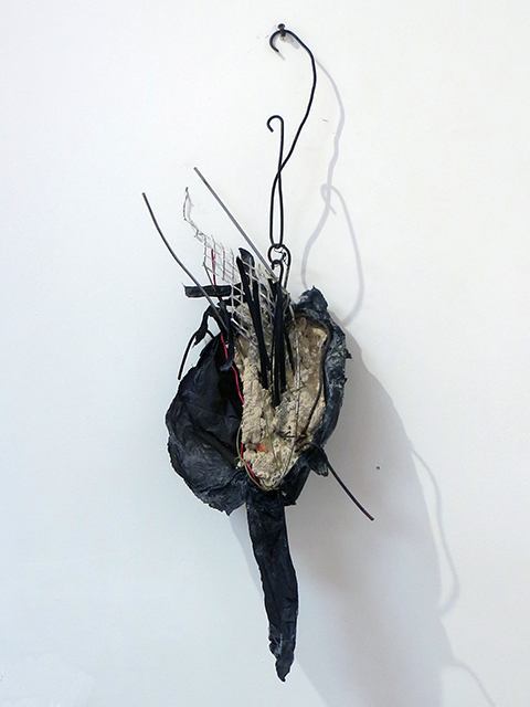 “In Time” mortar, wire, paper and found objects, by Eric Beckerich
