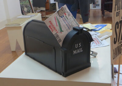 Fred Cole “Lock Out The Vote”, mixed media sculpture with mailbox, bicycle locks, & collage $200.00