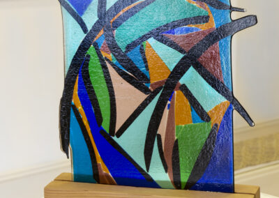 Ellen Rebarber “Breaking Out”, fused glass with dichroic glass on wood base, $1,800.00