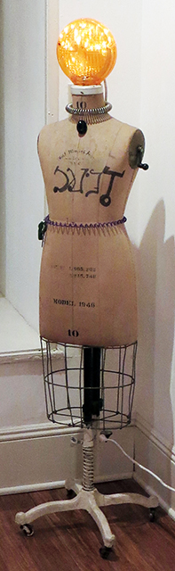 Fred Cole    – “Jeannie” dress maker’s mannequin, electric cord light, street lamp lens