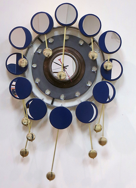Randall Cleaver -“Moon Days Times 2” cookie tins, bike rim, metal plate, grill pan, plastic balls, “L” brackets, brass plumbing part, new pendulum and clock movements