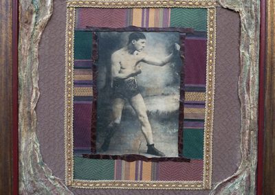 “The Boxer” – collage on canvas with halftone print, colored pencil, fabric, leather, gauze and oil paint 23″ W x 28″” H