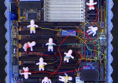The Nursery – collage on panel with computer motherboard, plastic baby dolls, wire, ric rac lace – 12″ x 12″