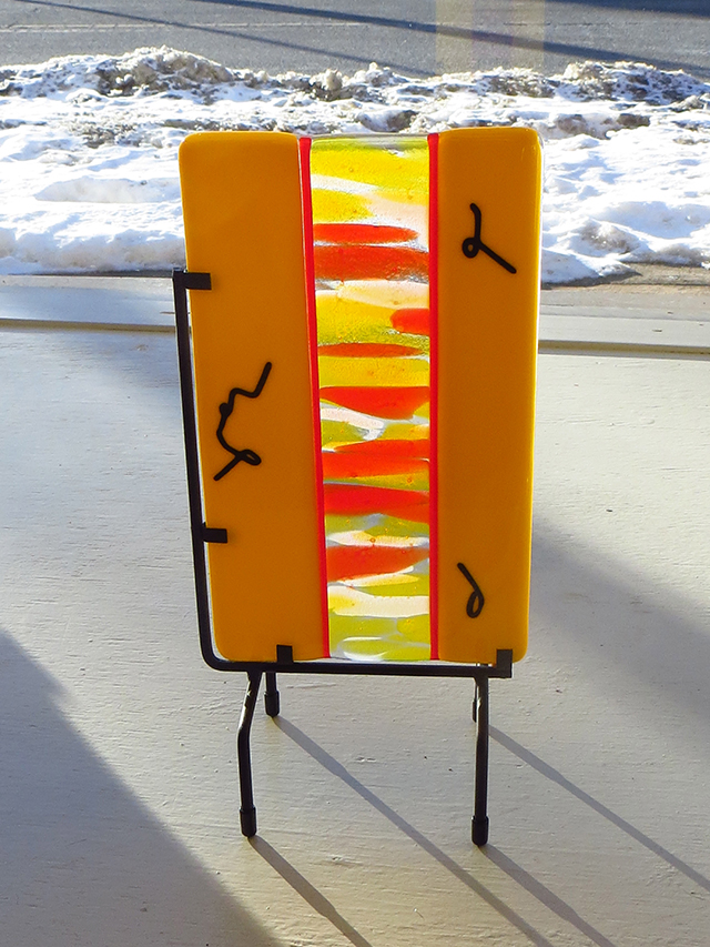 Ellen Rebarber   “Secret Message” Fused yellow glass with red, orange, white and black