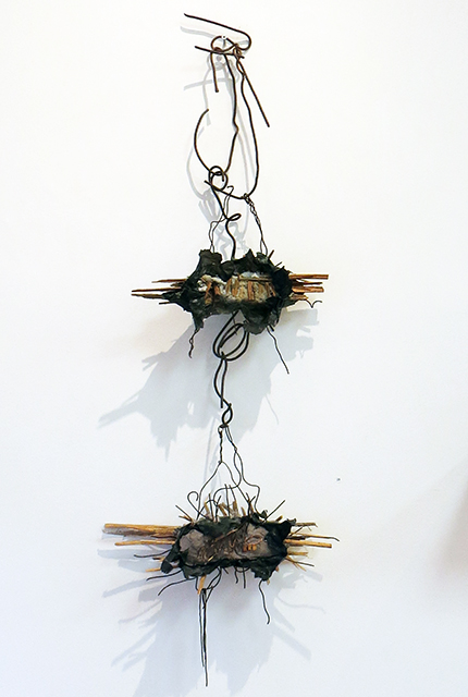 “Hanging Abstract”  mortar, wire paper and found objects, – by Eric Beckerich