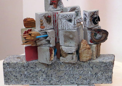 “At the Opening” mortar and found objects,  by Eric Beckerich