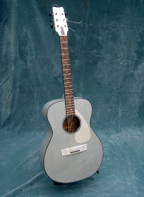 Duct Tape Guitar – found guitar busted open in the back, repaired adduct taped and silver paint on neck