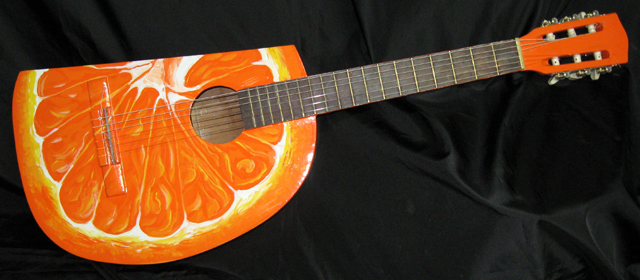 Orange Slice Guitar – found acoustic guitar, guitar body parts, bondo body filler, paint