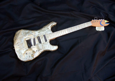 Smell-A-Caster – found electric guitar body, electric guitar parts, handmade neck and body plated with sardine cans, reflective vinyl fish scales