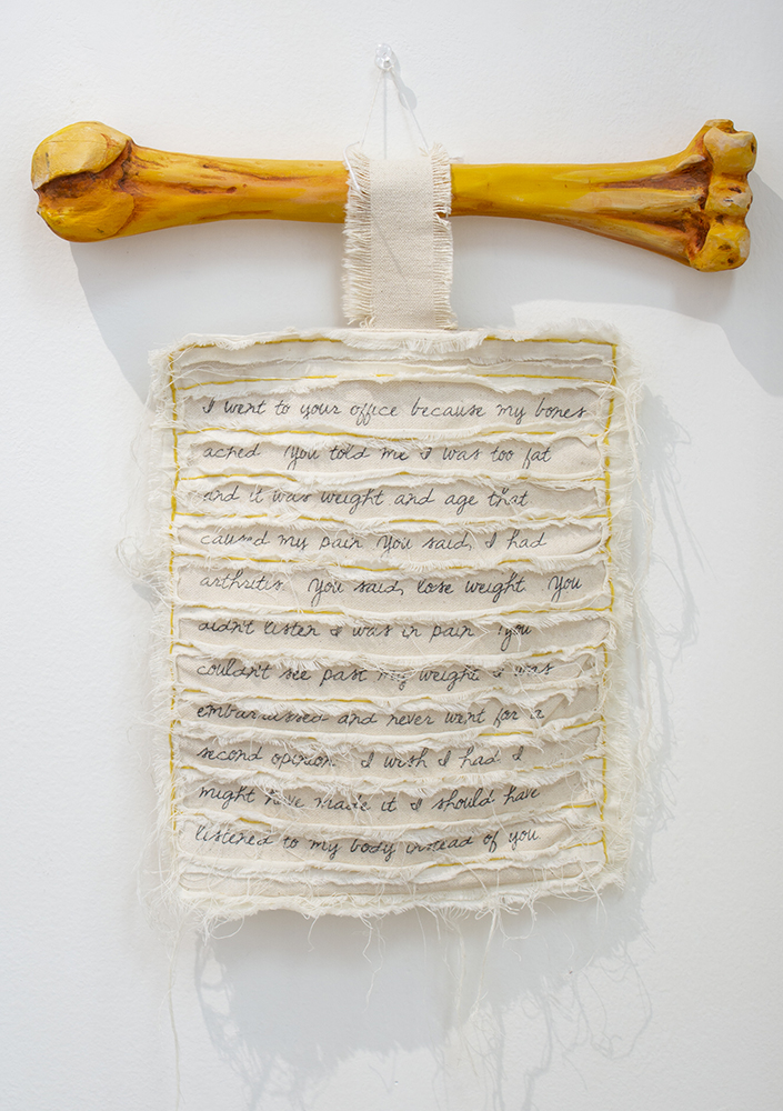 Eryn Lewis “The Doctor’s Note” wall mounted sculpture, canvas, wood, paint, silk ribbon, $500.00