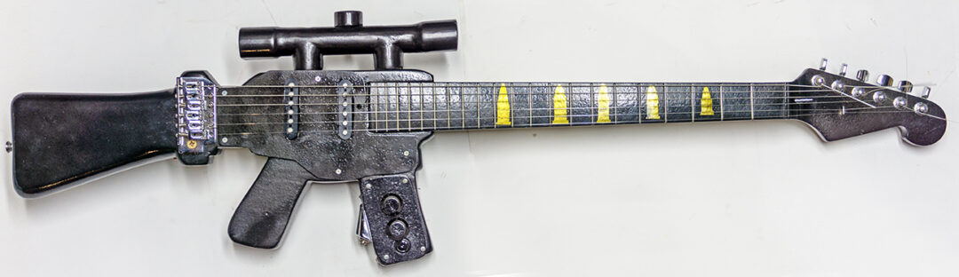 Assault Guitar – cut and shaped wood, electric guitar parts, paint – $600.00