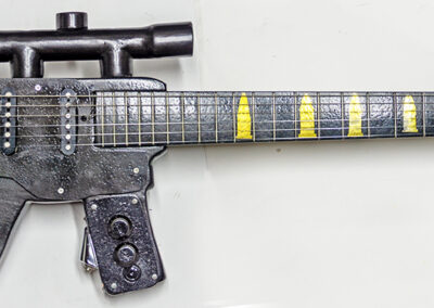 Assault Guitar – cut and shaped wood, electric guitar parts, paint – $600.00