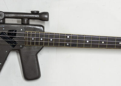 Assault Bass – cut and shaped wood, electric bass guitar parts, self wound pickups, paint – $450.00