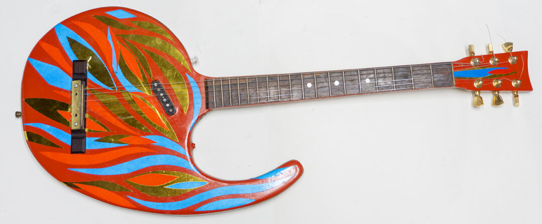 Comma Guitar – carved oak panel, electric guitar parts, paint, reflective vinyl – $300.00