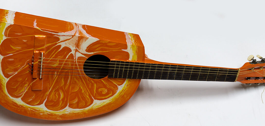 Orange Slice Guitar – found acoustic guitar with guitar parts added, paint – $300.00